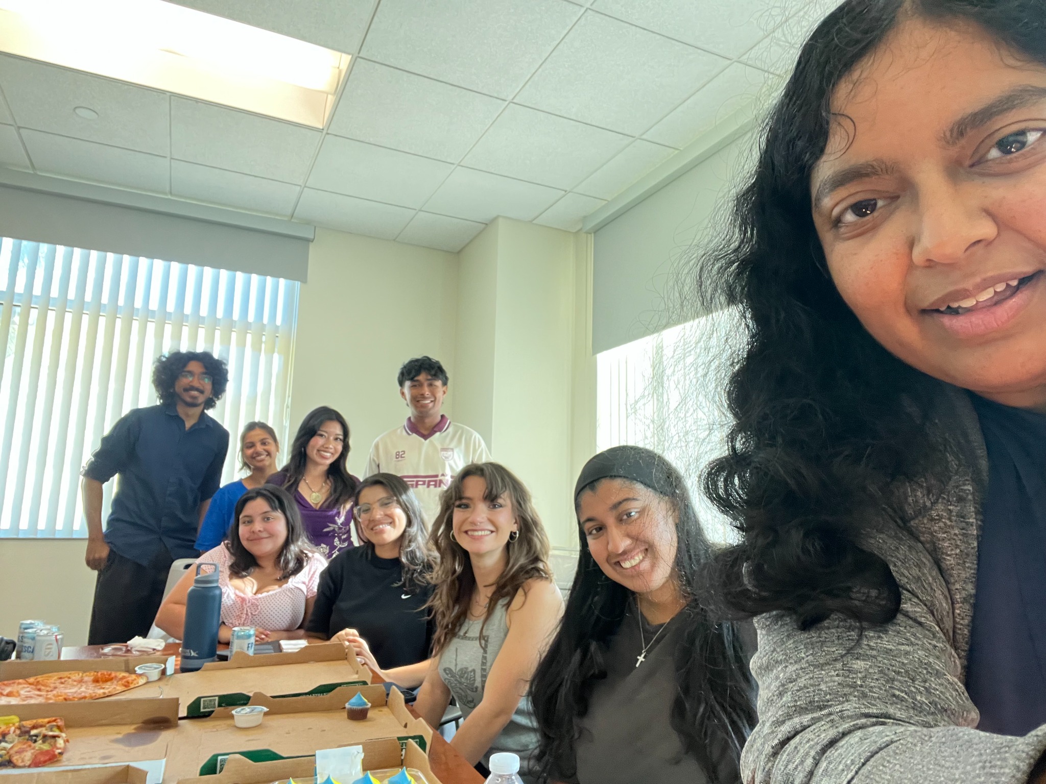 Lab group gathered around a table for a shared meal.